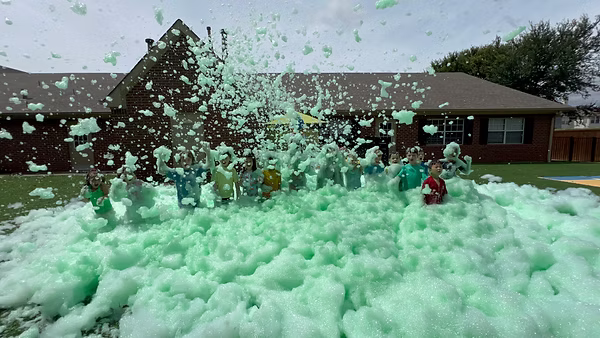 Kids enjoying a foam party moment 4