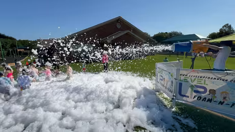 Kids enjoying a foam party at LUMA Sportz N Fun